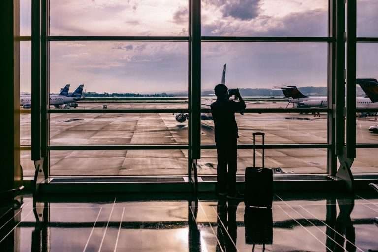 Person taking a photo of an aeroplane corporate 768x512